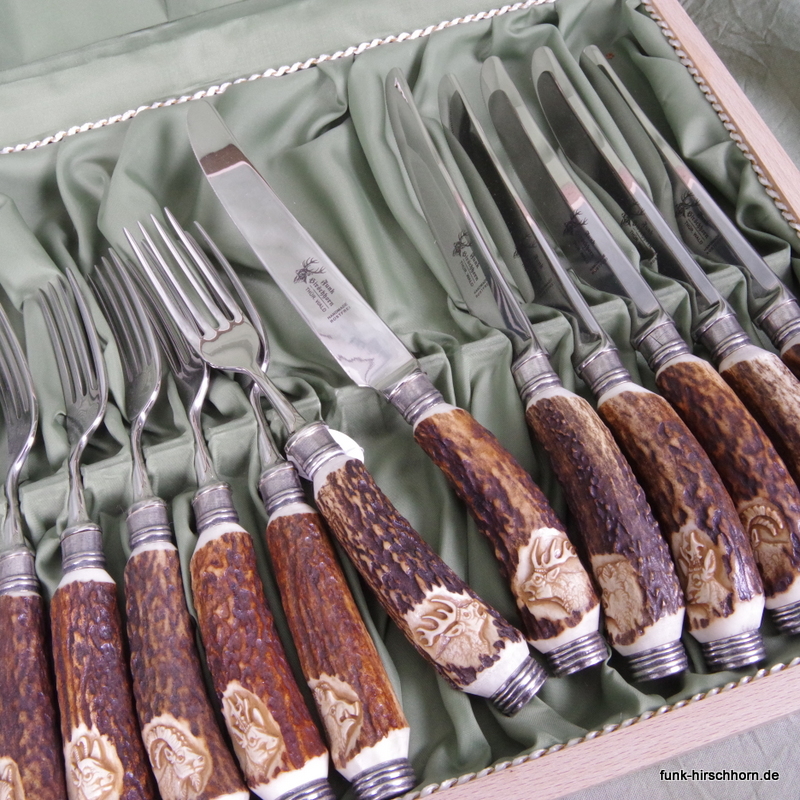 12-tlg. Tafelbesteck mit handgeschnitzten Hirschhorngriffen